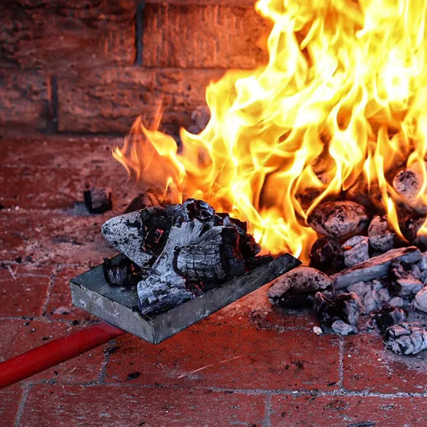 Coal Scoop Moving Hot Coals with Flames