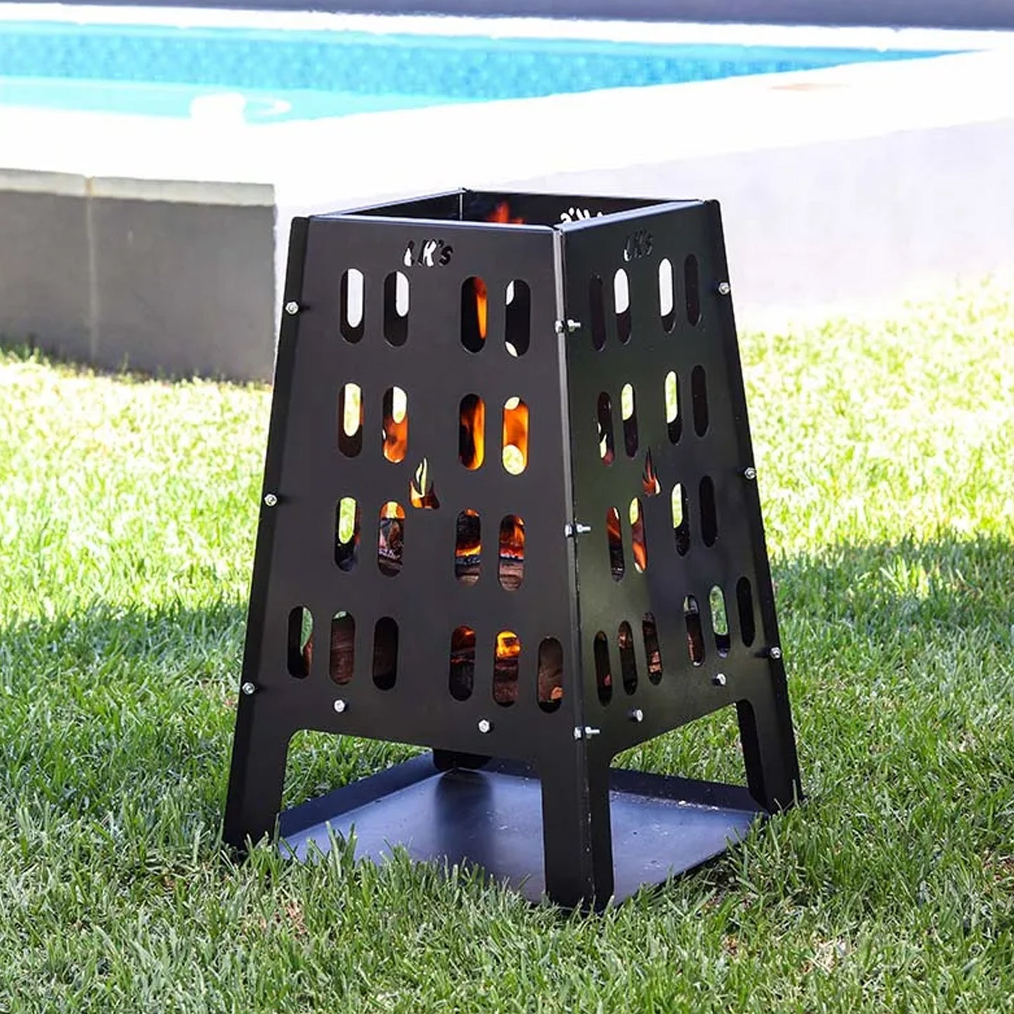 Firepit Tower Burning with Pool in the Background