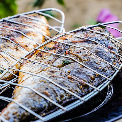 Fish Being Cooked in a Cooking Grid